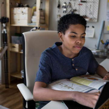 Teenage boy studies for science test