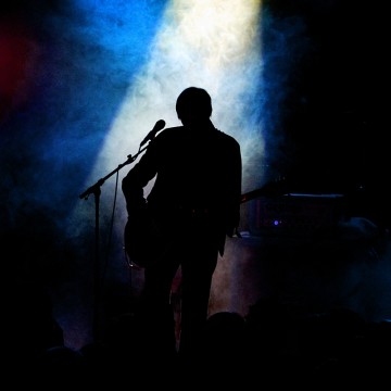 Silhouette,On,Stage,With,Backlight,From,Stage,Lights