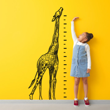 Surprised,African-american,Girl,Measuring,Height,Near,Color,Wall,With,Drawn