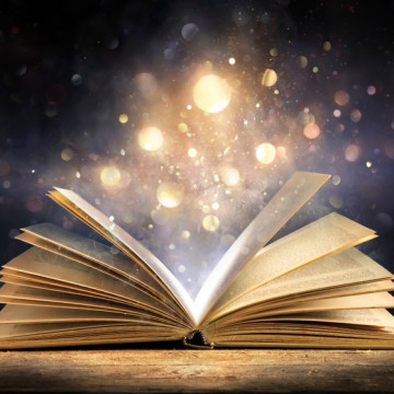 Magic,Book,With,Open,Antique,Pages,And,Abstract,Bokeh,Lights