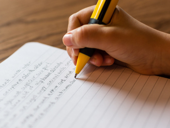 Close-up,Of,Human,Hand,With,Refillable,Pencil,Writing,English,Words