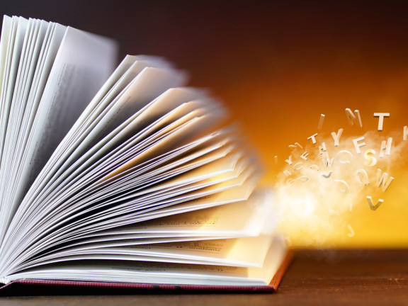 Open,Book,With,Flying,Letters,With,A,Beauty,Magical,Glow
